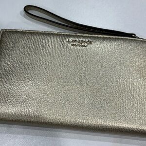 Kate spade gold metallic wristlet. Used once!